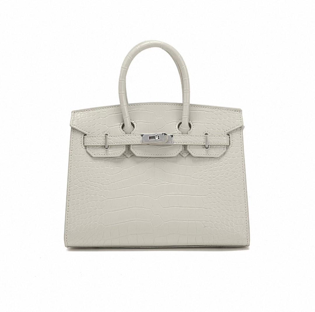 Front view of white Hermès structured satchel bag