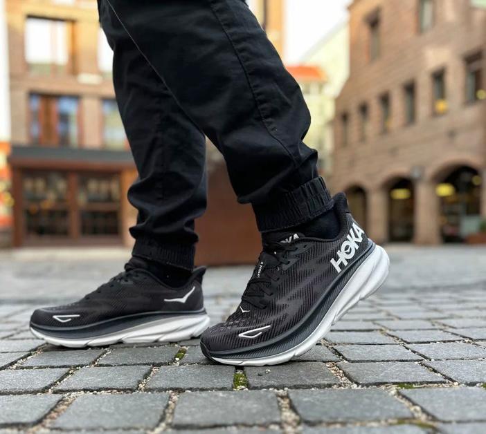 HOKA Bondi 9 black white running sneakers on feet