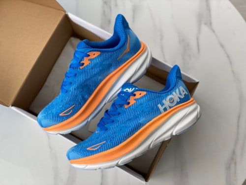 Pair of HOKA Carbon X 3 blue and orange running shoes