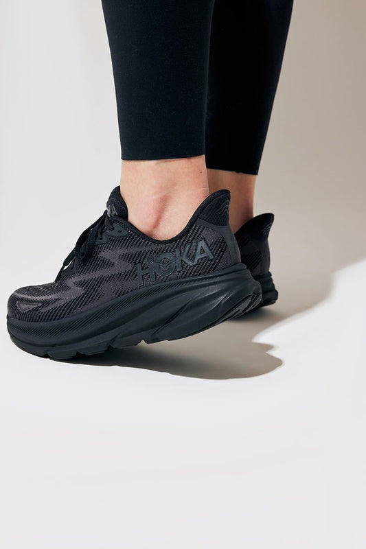 HOKA Clifton 9 black slate sneakers on feet