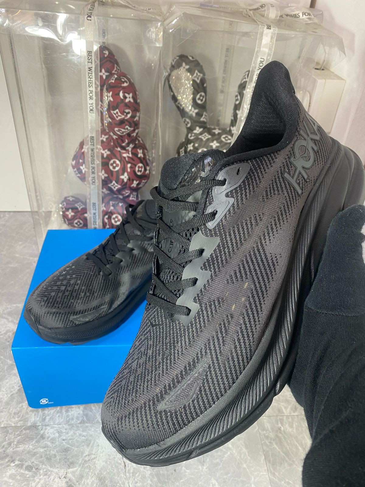 HOKA Clifton 9 black sneakers at Aone Brands Dubai