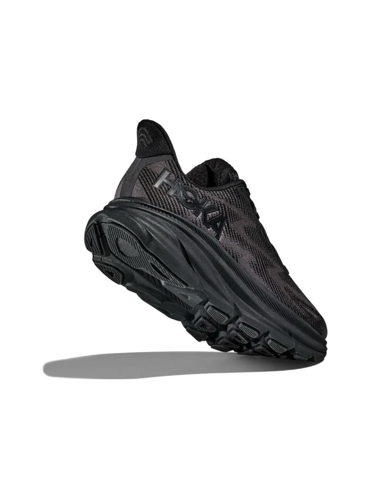 HOKA Clifton 9 black sneakers lifestyle side view