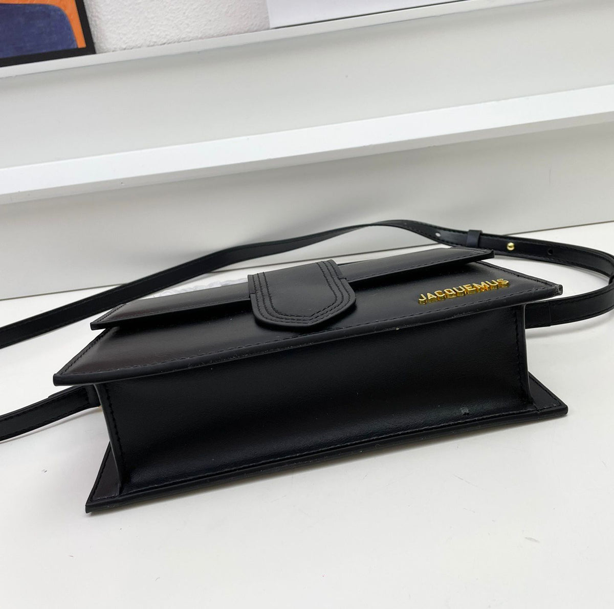 Side view of Jacquemus style mini shoulder handbag