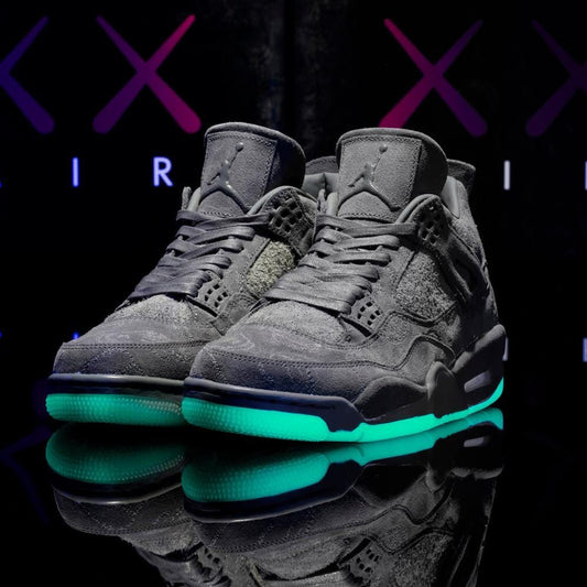 KAWS x Air Jordan 4 Cool Grey sneakers glow sole view