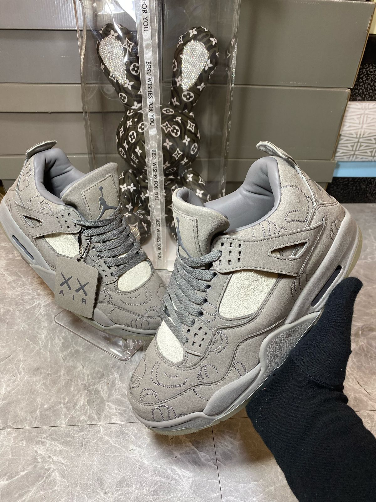 KAWS x Air Jordan 4 Cool Grey sneakers at Aone Brands Dubai
