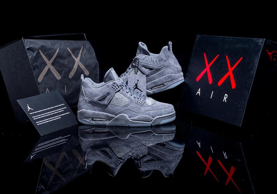 KAWS x Air Jordan 4 Cool Grey sneakers pair view