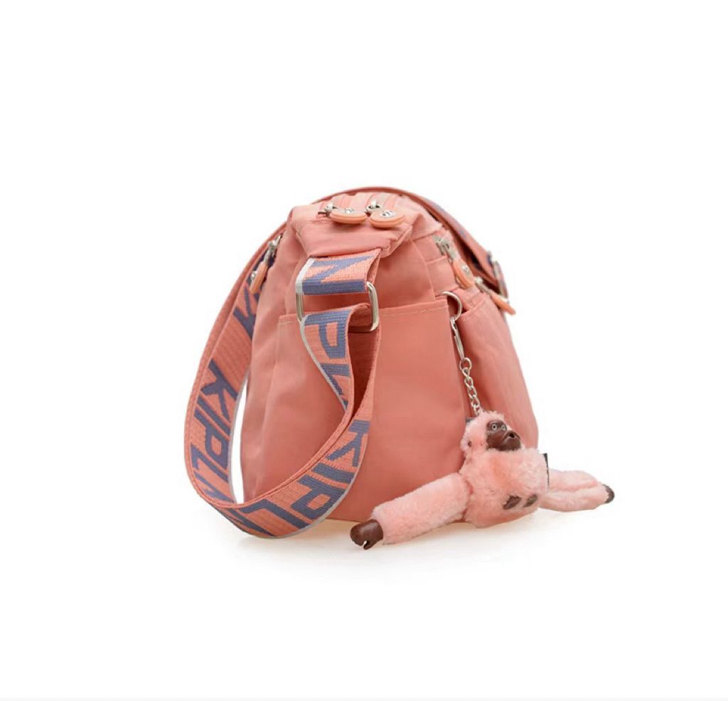 Side view of lightweight Kipling style crossbody bag for women