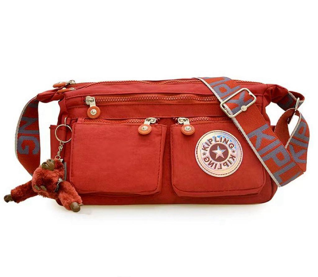Red Crossbody Kipling style women's shoulder bag available at Aone Brands Dubai