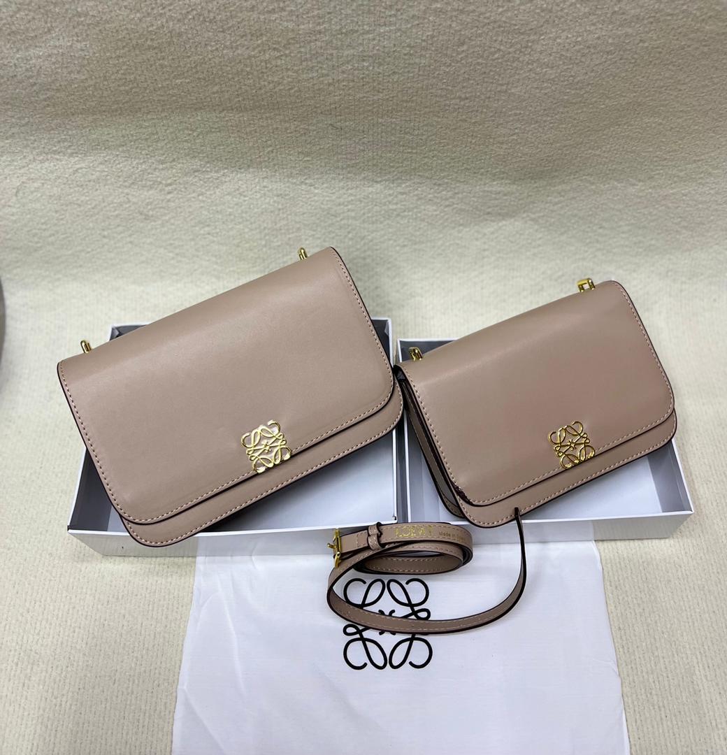 Beige Loewe handbags with elegant flap design