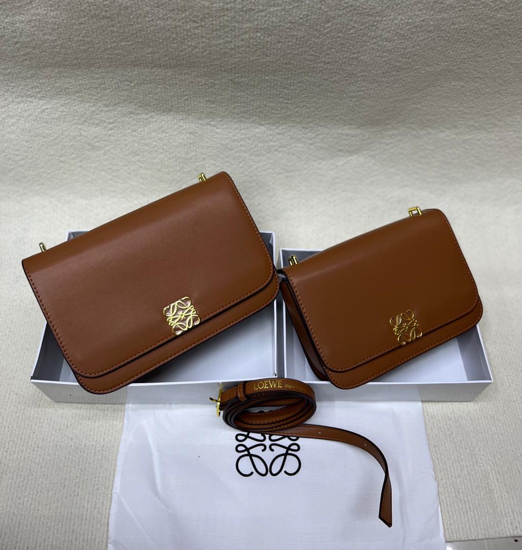Brown Loewe crossbody bags with flap closure and gold-tone logo