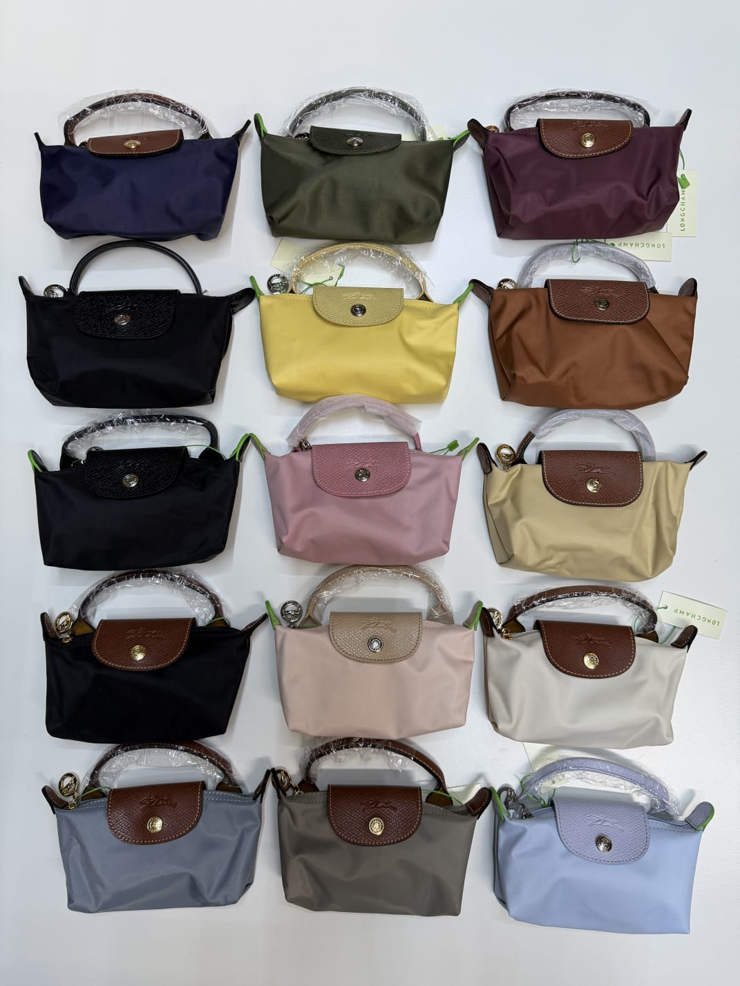 Longchamp women’s mini crossbody bags in multiple colours available in UAE