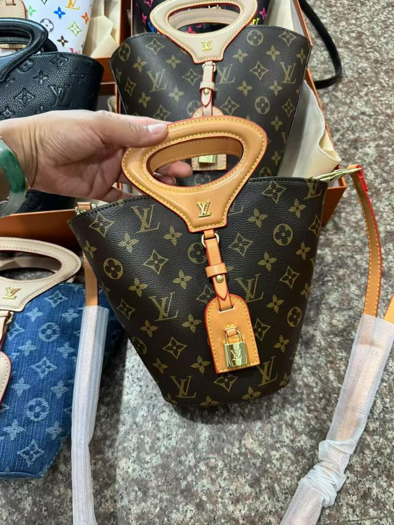 Front view of brown Louis Vuitton mini handbag