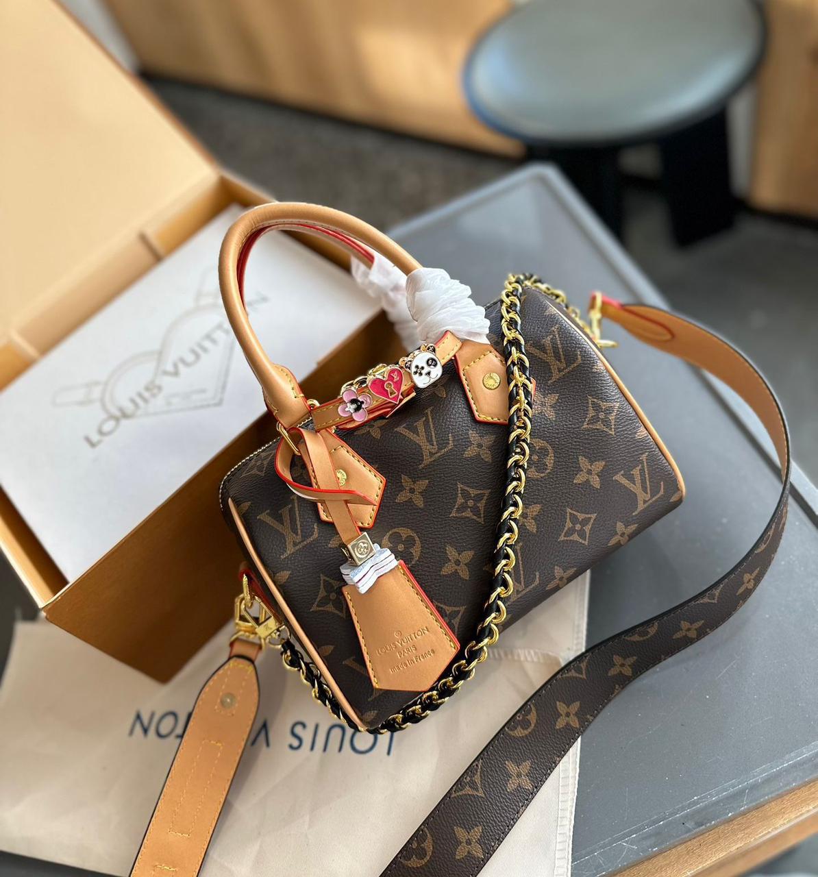 Classic brown monogram canvas Louis Vuitton mini top handle bag with shoulder strap