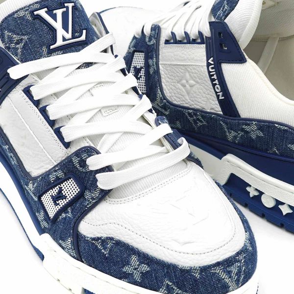 Close-up of Louis Vuitton LV Trainer Blue Monogram denim details
