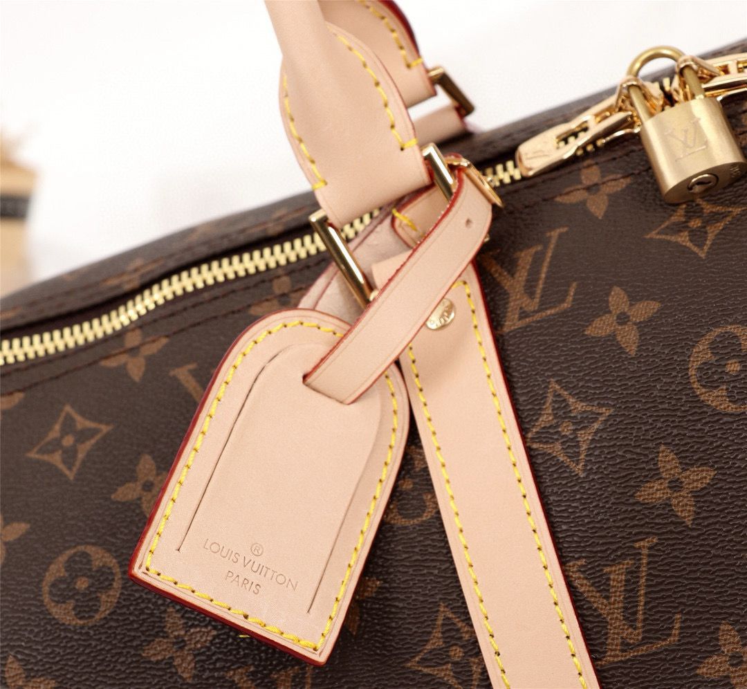 Louis Vuitton monogram travel bag leather handle and detailing close up