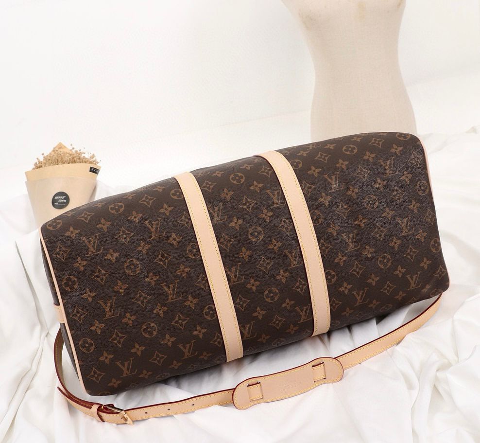 Louis Vuitton monogram canvas travel bag zip and leather detail
