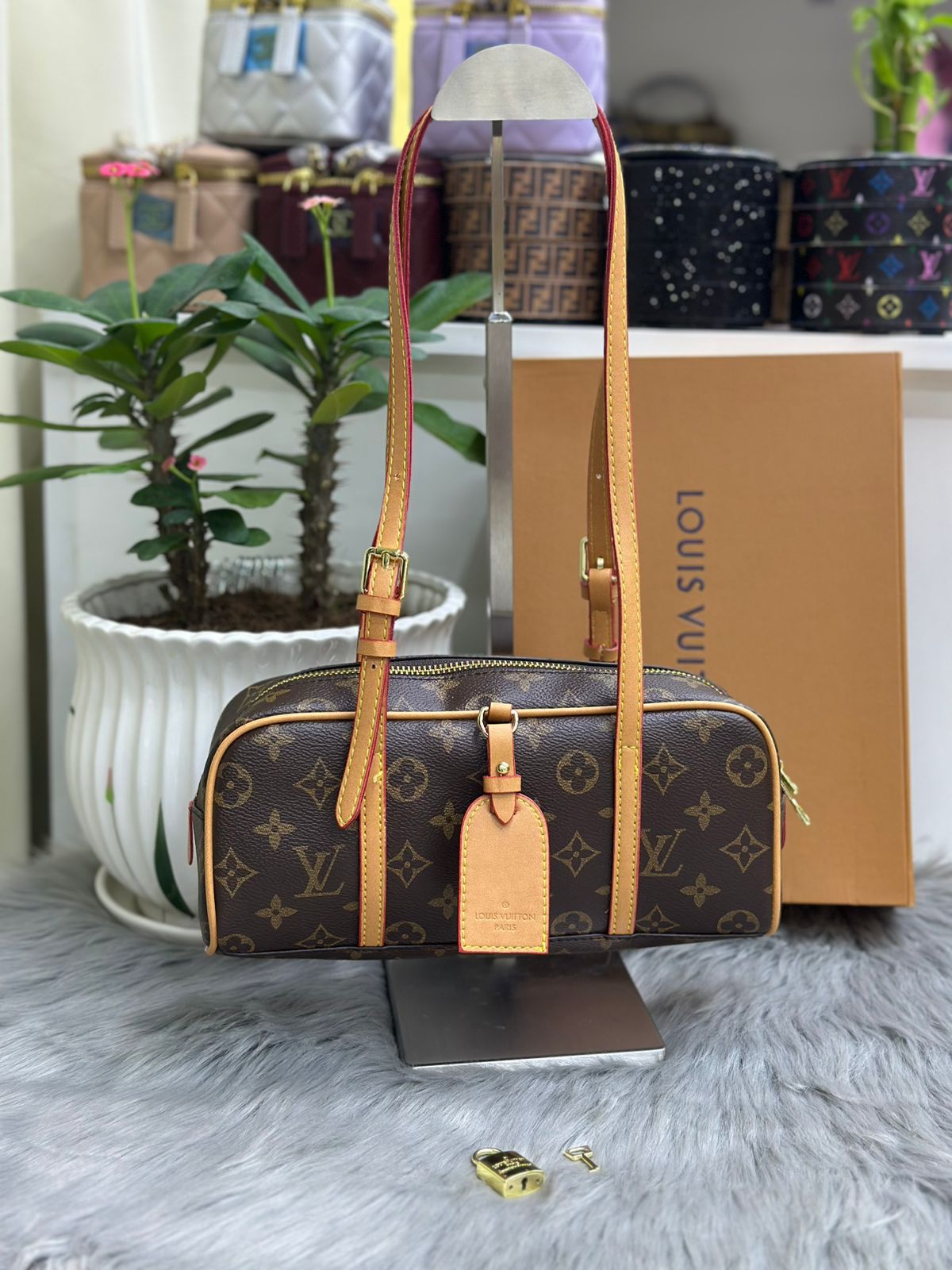 Louis Vuitton classic monogram canvas barrel bag with tan leather straps