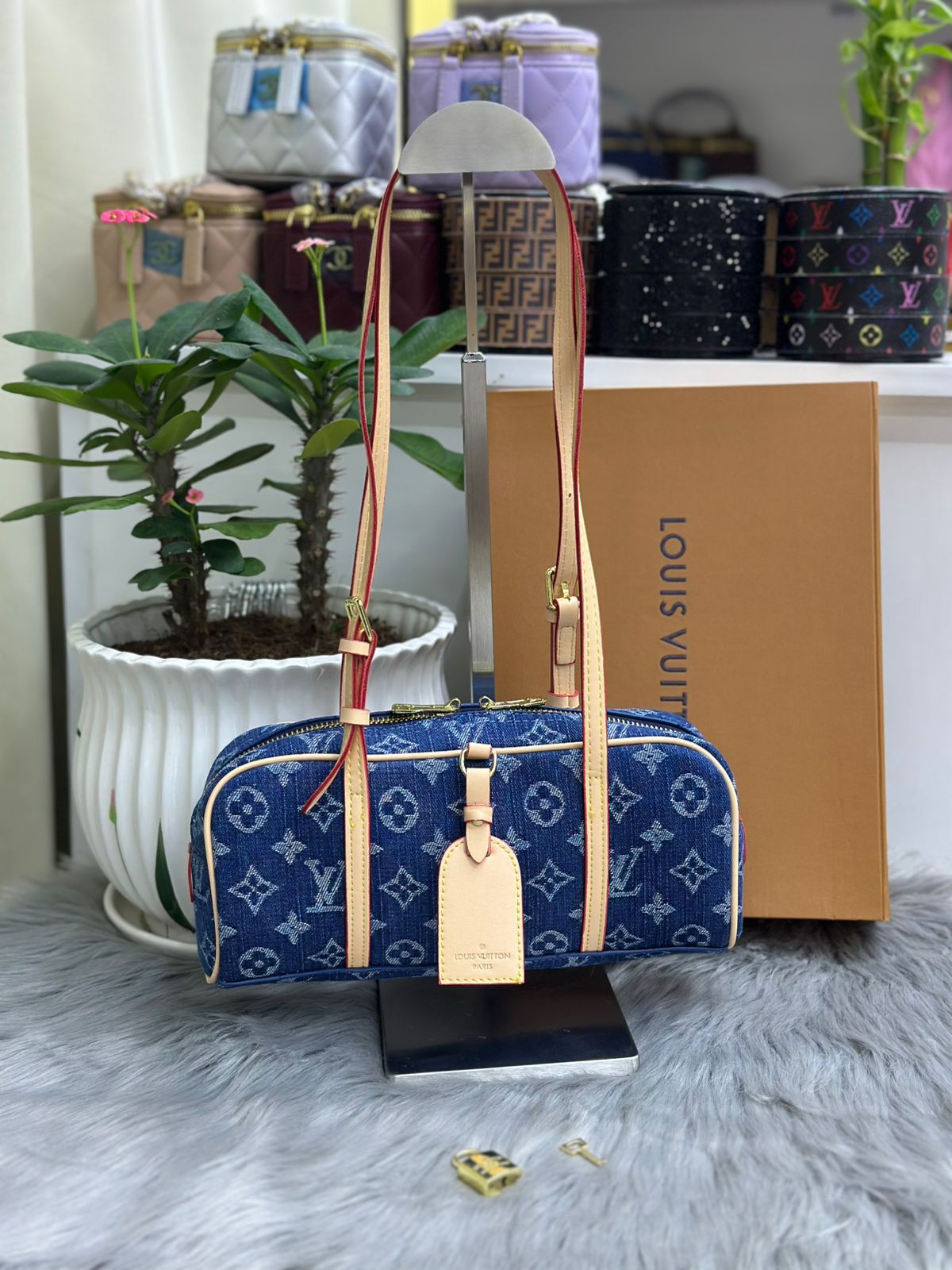 Louis Vuitton monogram denim blue barrel shoulder bag with leather key tag