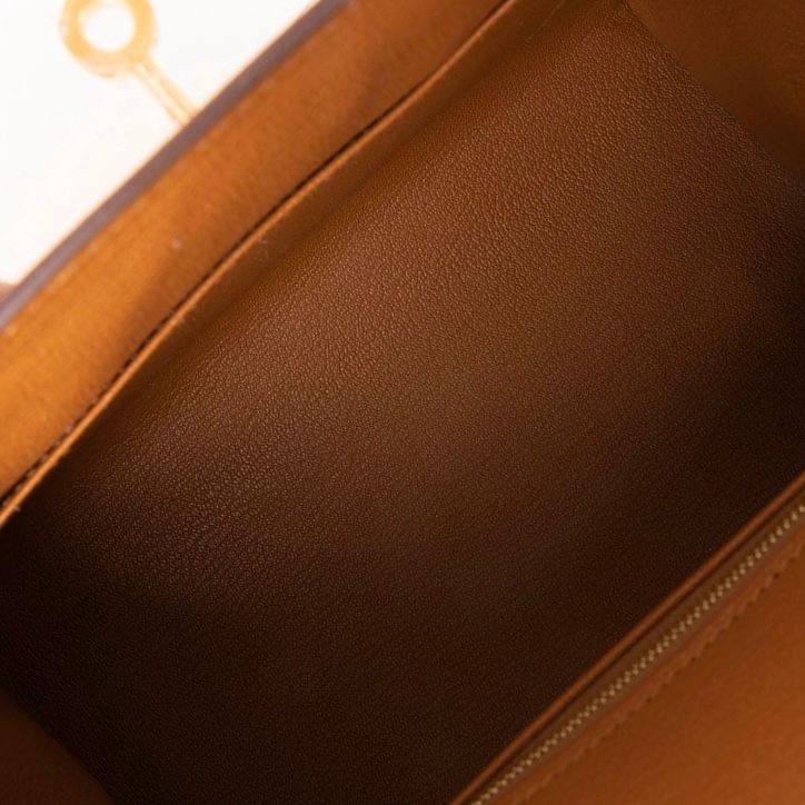 Spacious interior compartment and smooth leather lining of designer bag