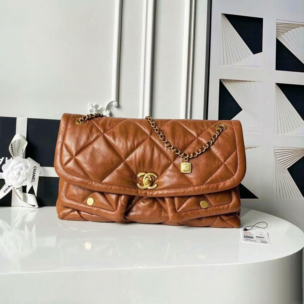 Warm camel tan quilted leather flap shoulder bag with front pockets