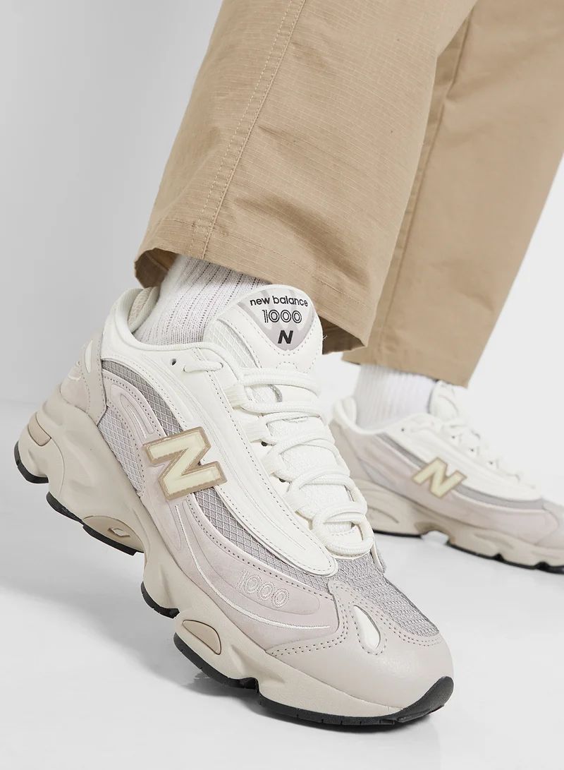 Cream New Balance 1000 sneakers shown on foot