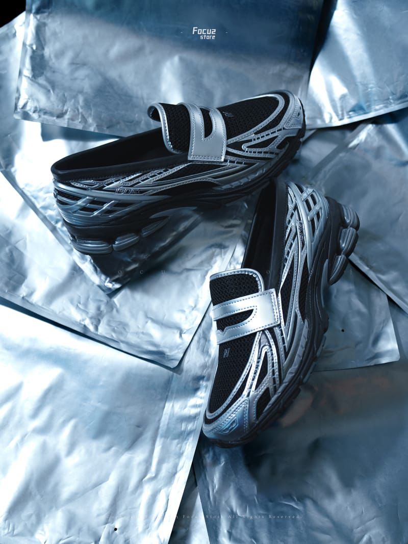New Balance 1906L silver metallic black sneakers lifestyle view