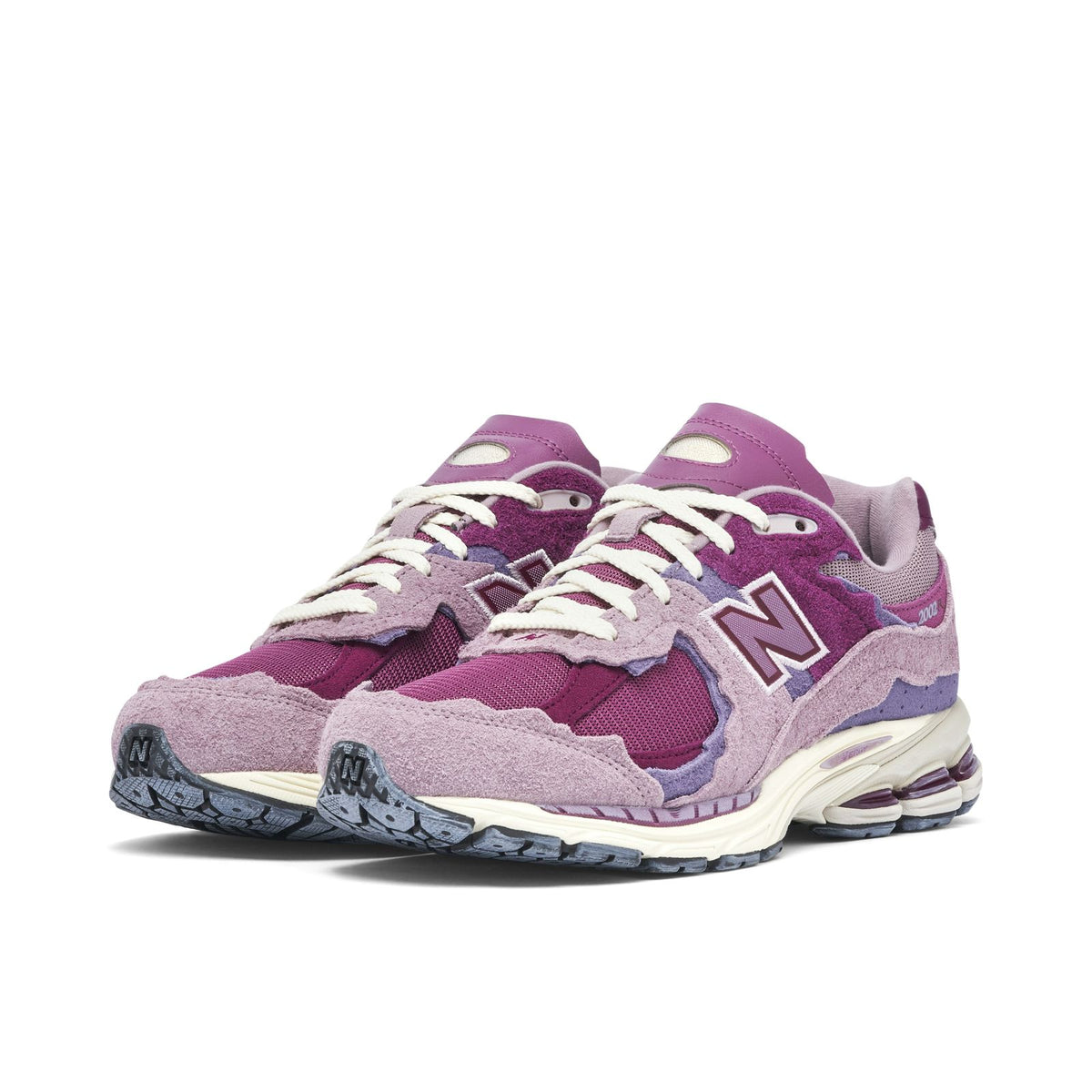 New Balance 2002R pink and purple sneakers pair view