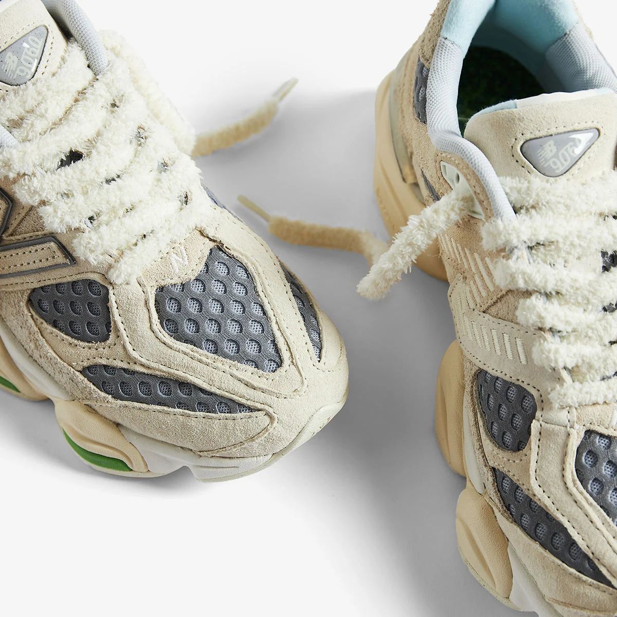 New Balance 9060 cream grey green sneakers close-up