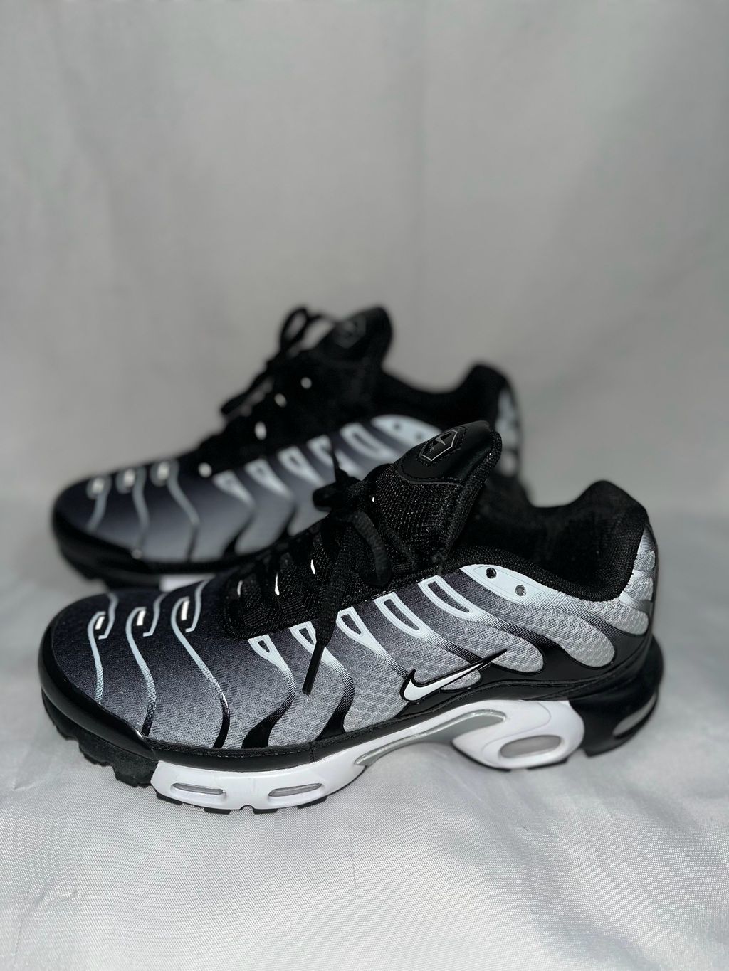 Nike Air Max Plus black sneakers side view
