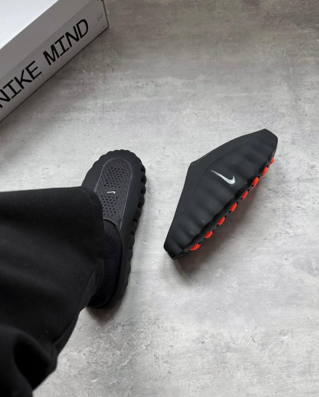 Nike Mind 001 Black Hyper Crimson unisex mules on feet