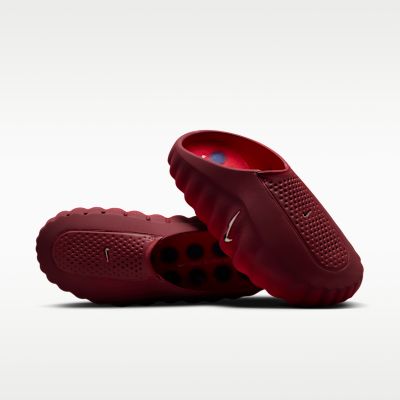 Articulated foam nodes under Nike Mind 001 Solar Red mules