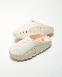 Pair of Nike Mind 001 White pregame mules
