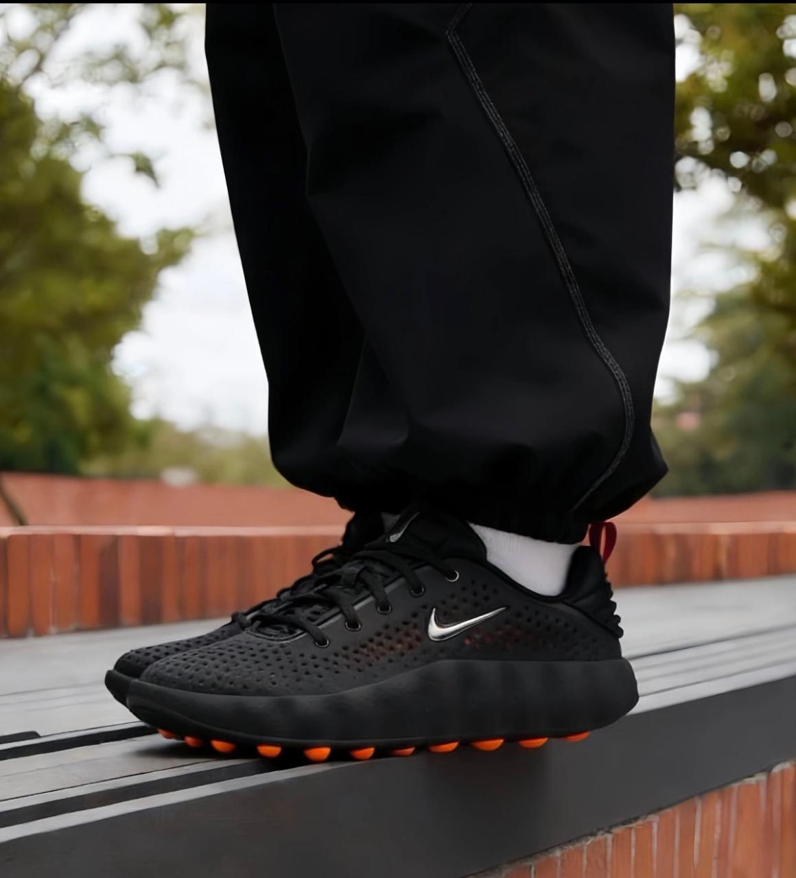 Nike Mind 002 Black Hyper Crimson sneakers on feet