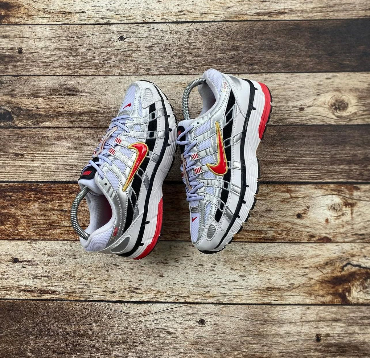 Nike P-6000 metallic silver black sneakers pair view
