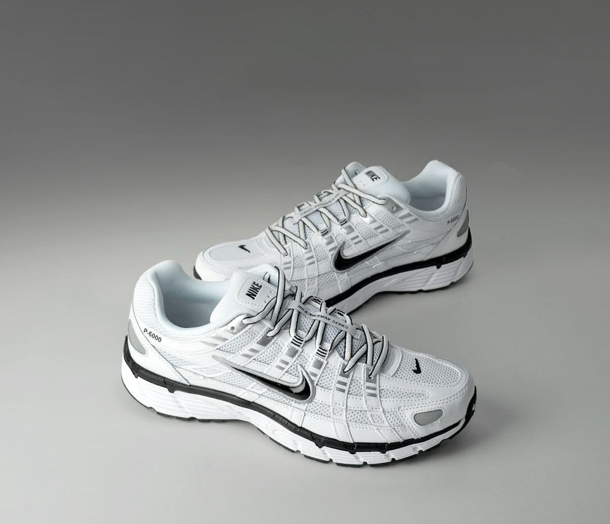 Nike P 6000 white metallic silver black sneakers pair view