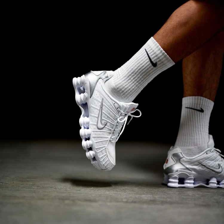 Nike Shox TL white metallic silver sneakers on feet
