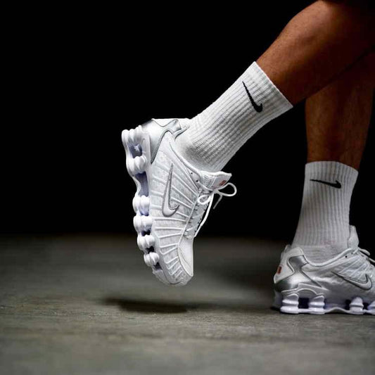 Nike Shox TL white metallic silver sneakers on feet