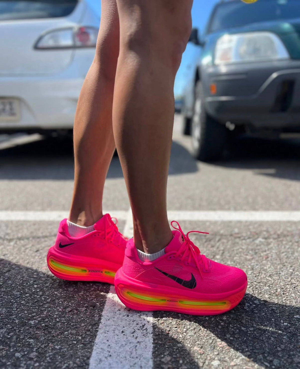 Nike Vomero Premium Hyper Pink Volt running sneakers on feet