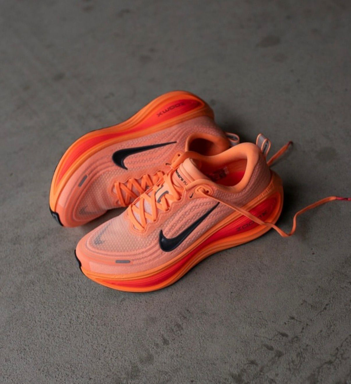 Nike Vomero Premium x Melitta Baumeister Total Orange running shoes pair view