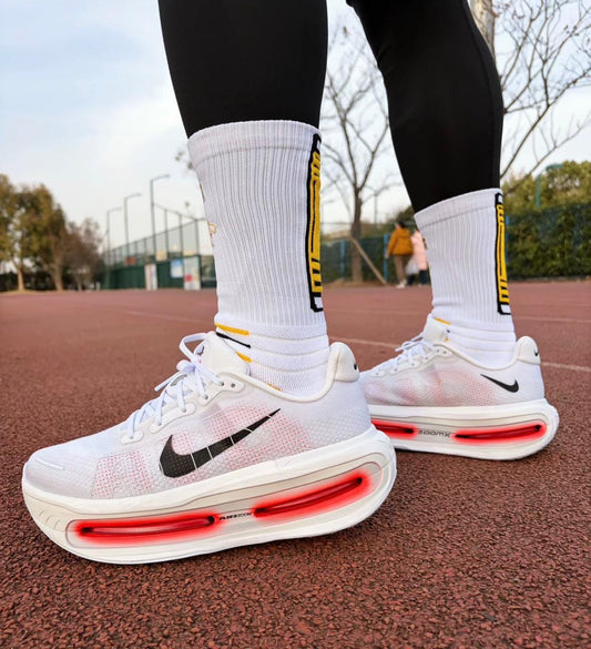 Nike Vomero Premium White Bright Crimson sneakers at Aone Brands Dubai