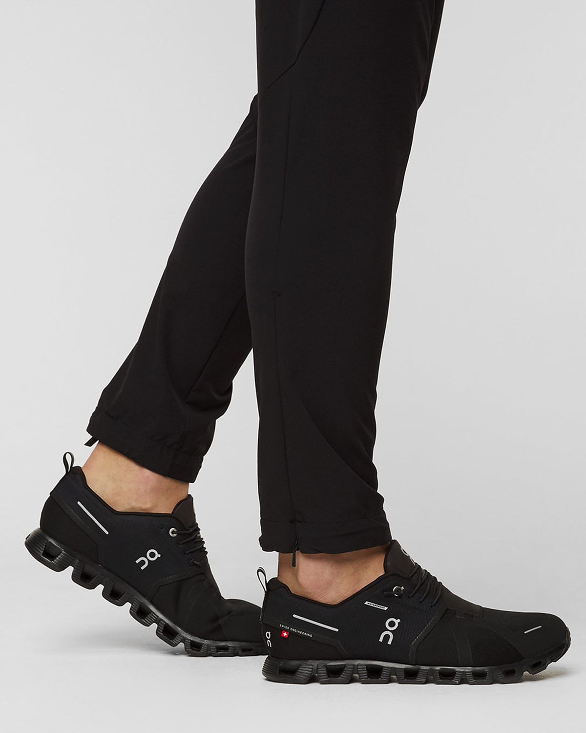 On Cloud 5 Waterproof black sneakers on feet