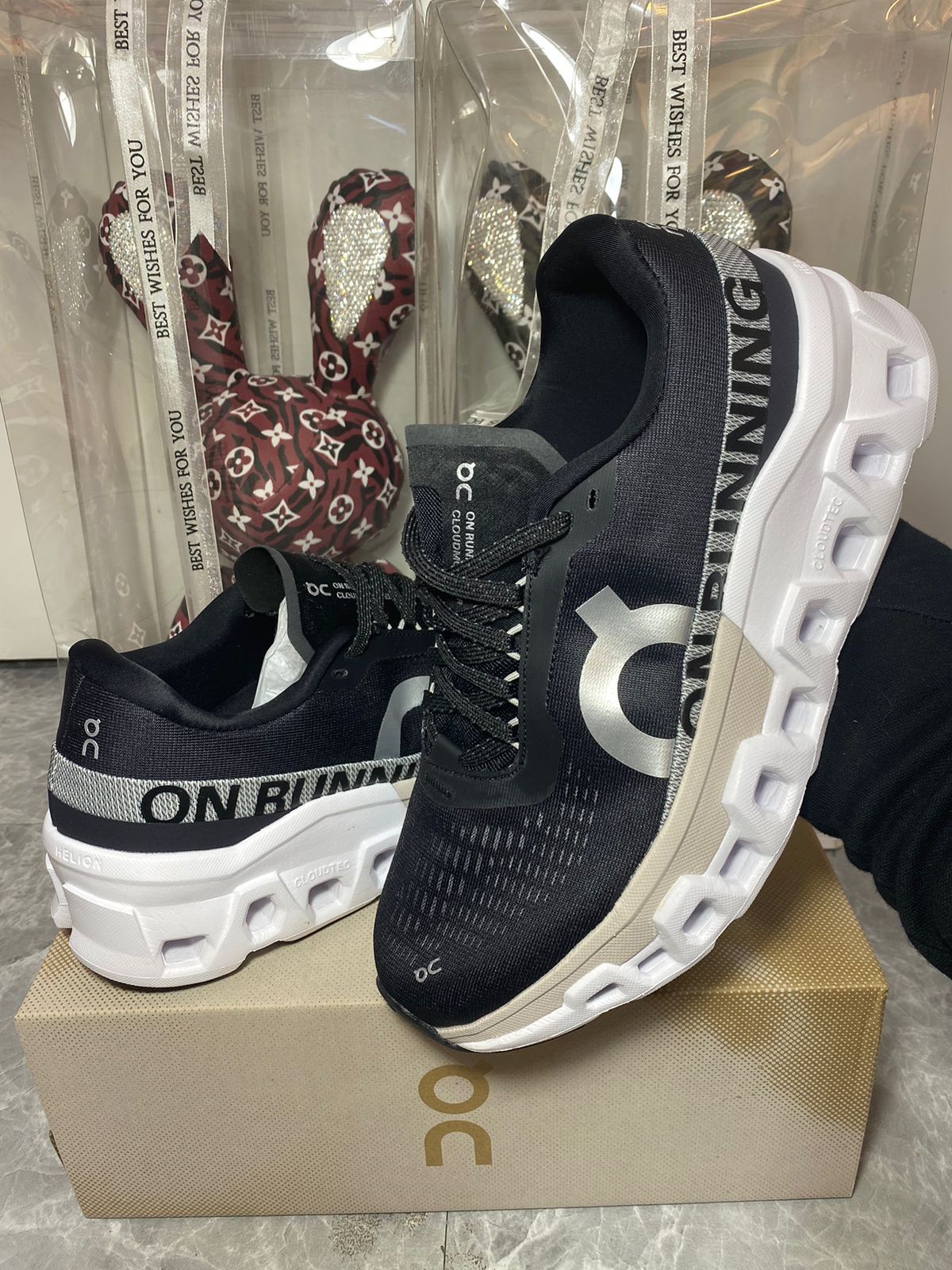 Pair of black and white On Cloud athletic shoes