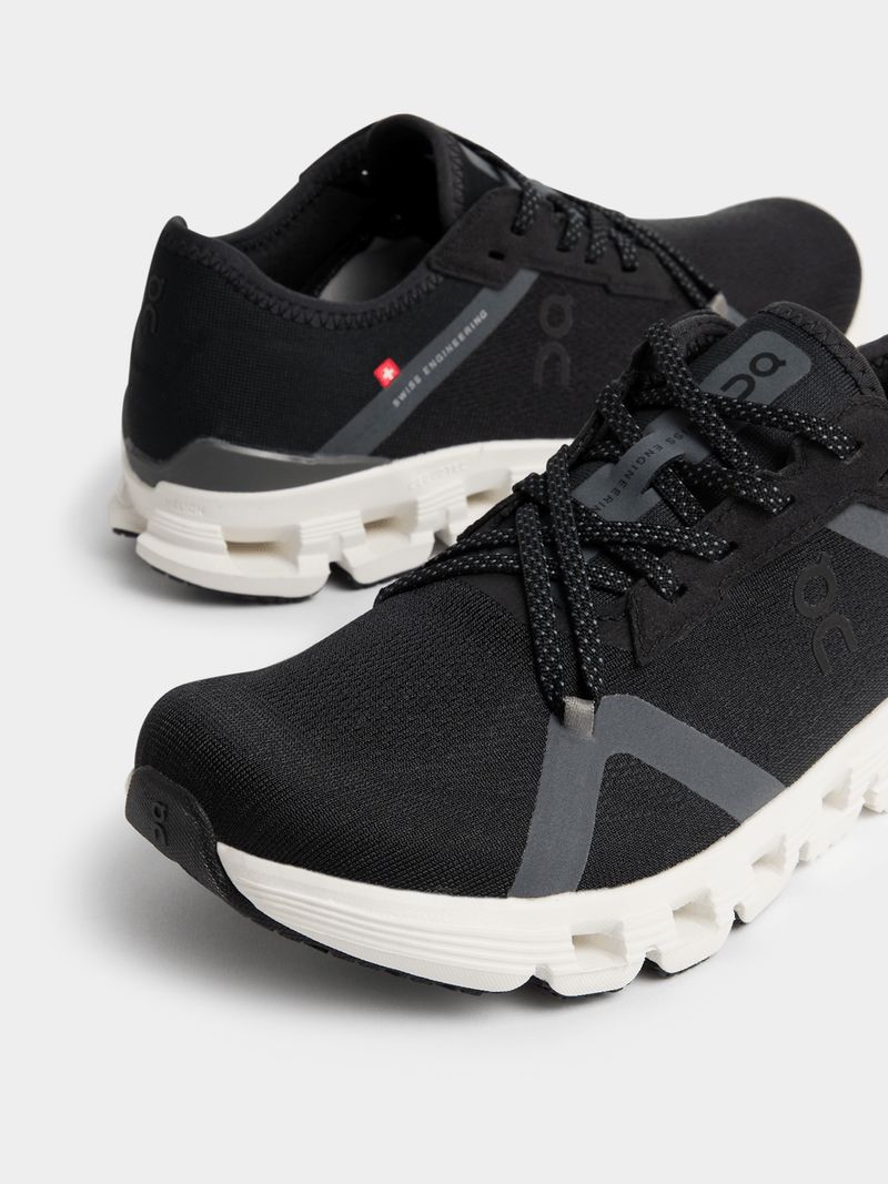 Pair of black and white On Cloud sneakers
