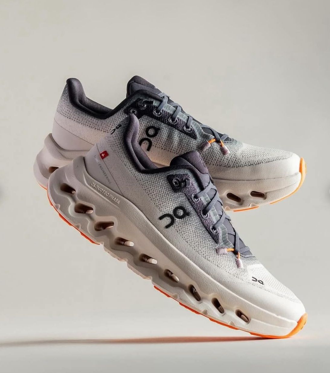 On Cloudmonster 3 shoes with Sunstone orange sole accents