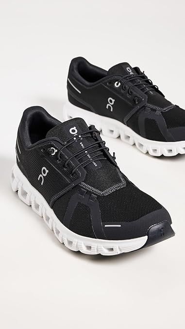 Pair of On Cloudmonster All Black running shoes