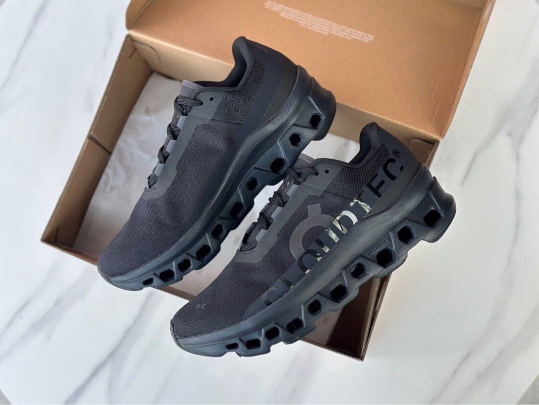 Grey On Cloudmonster shoes showing the pod-style sole