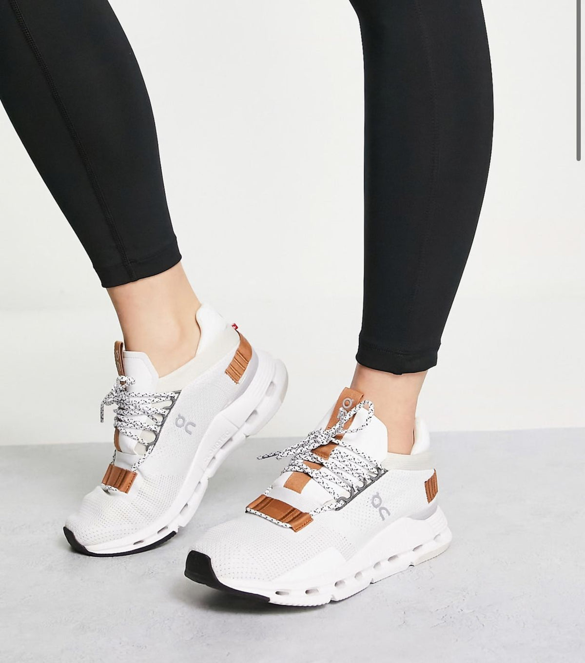 On Cloudnova white pearl brown sneakers on feet