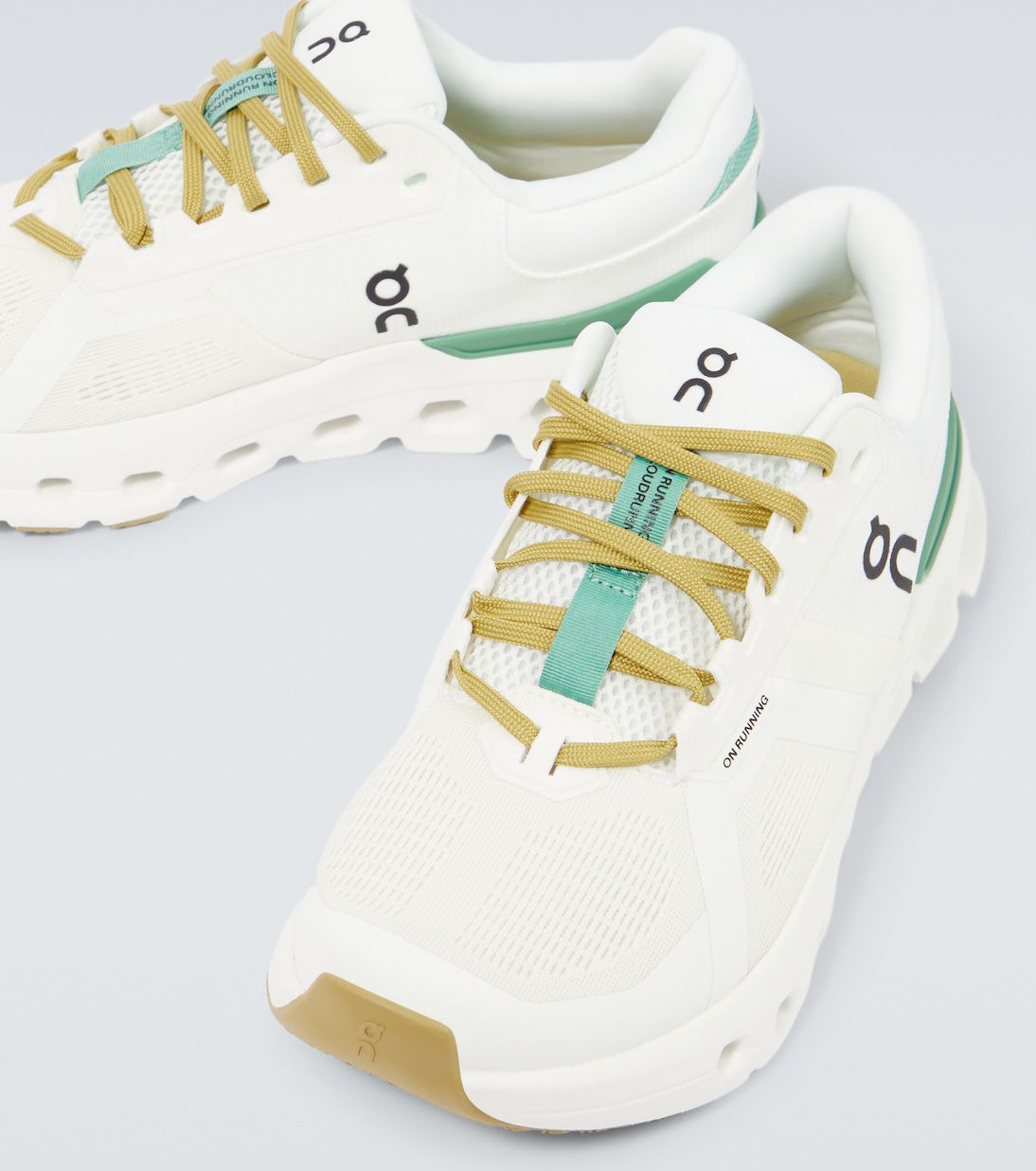On Cloudrunner 2 white green sneakers pair view