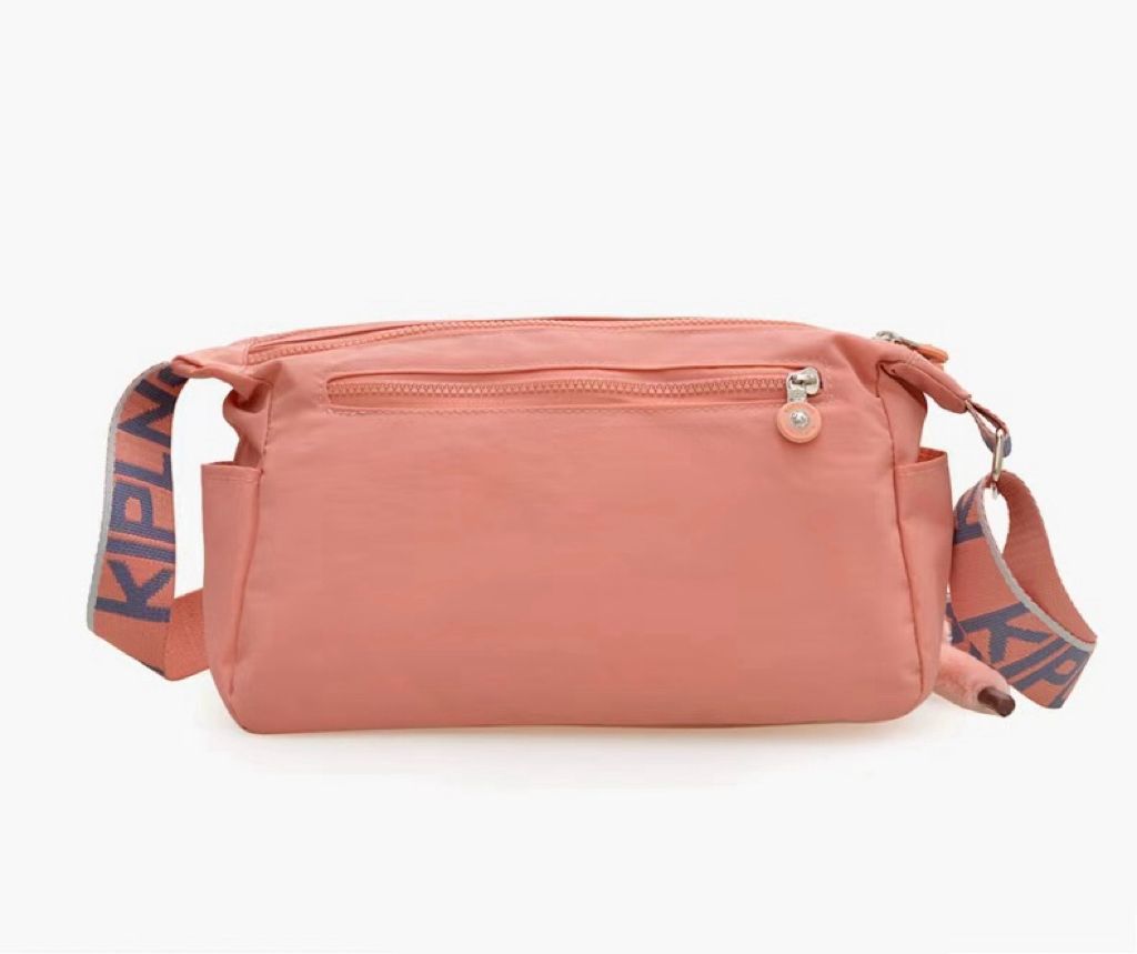 Orange Kipling style women's shoulder bag front view