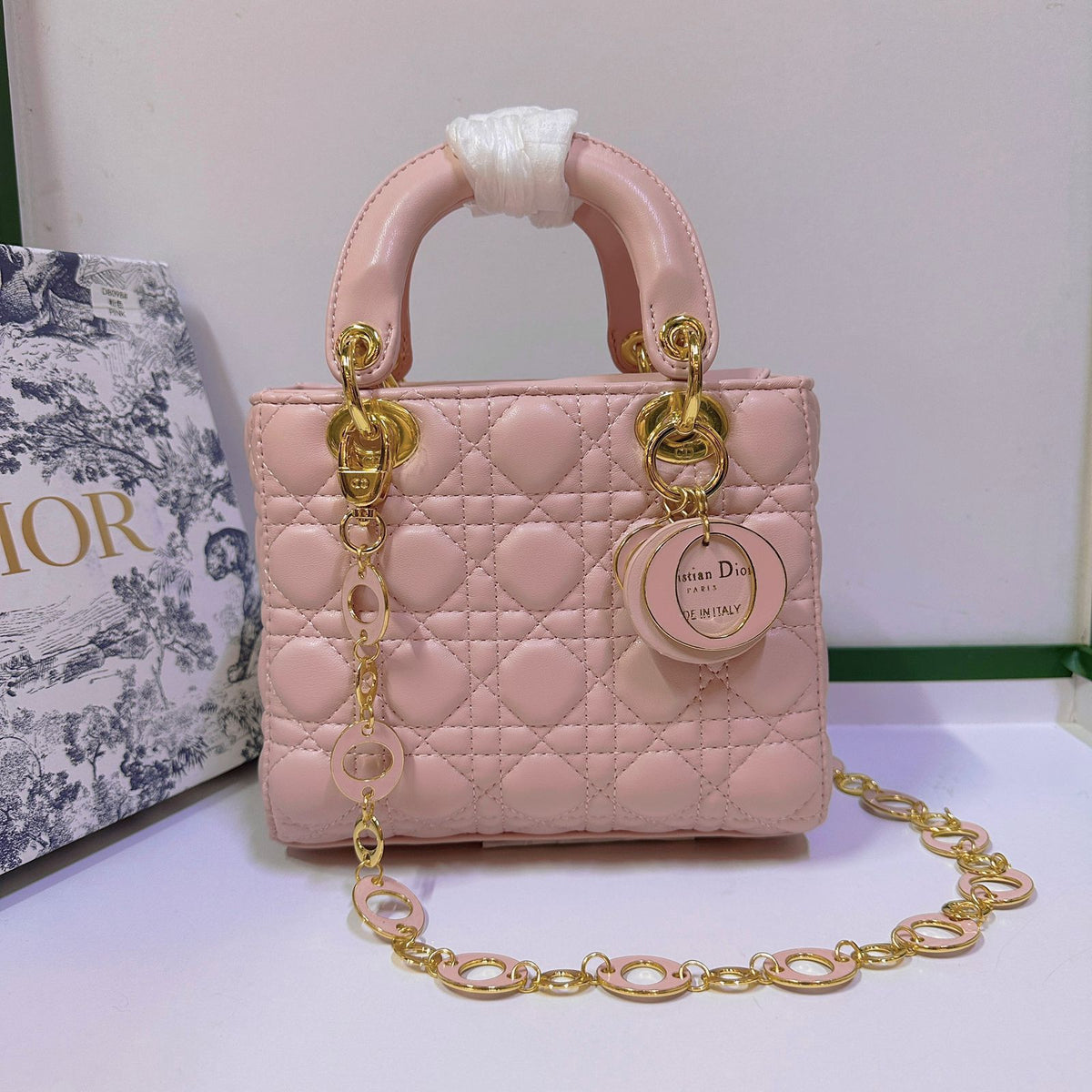 Red quilted handbag with elegant top handle design